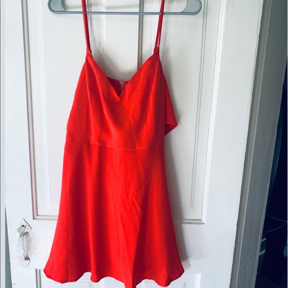 Pink Lily orange romper with Bow tie in back